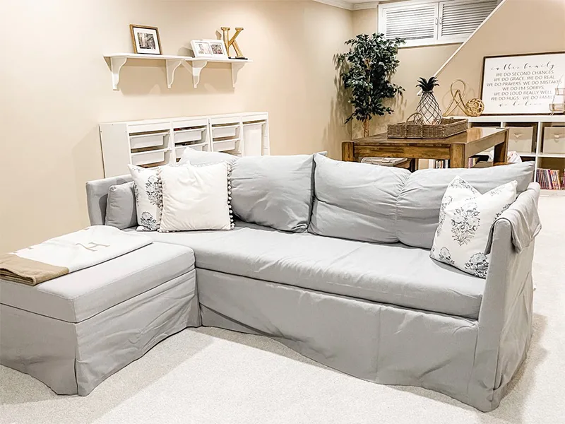 gray couch in a basement A gray couch in a basement | How to Create a Guest Room When You Don't Have One